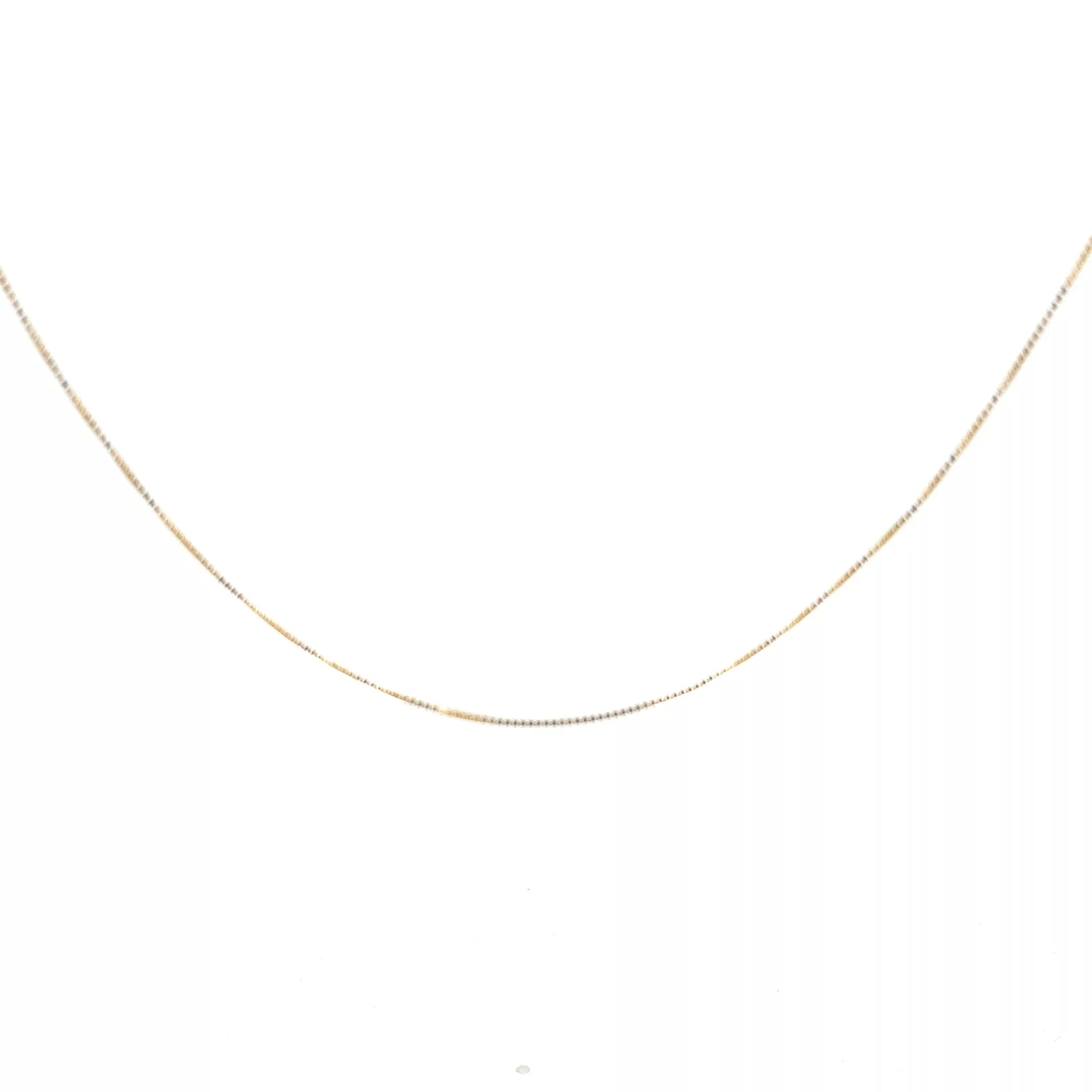 A 14 Karat Yellow Gold Cross Pendant on a white background.